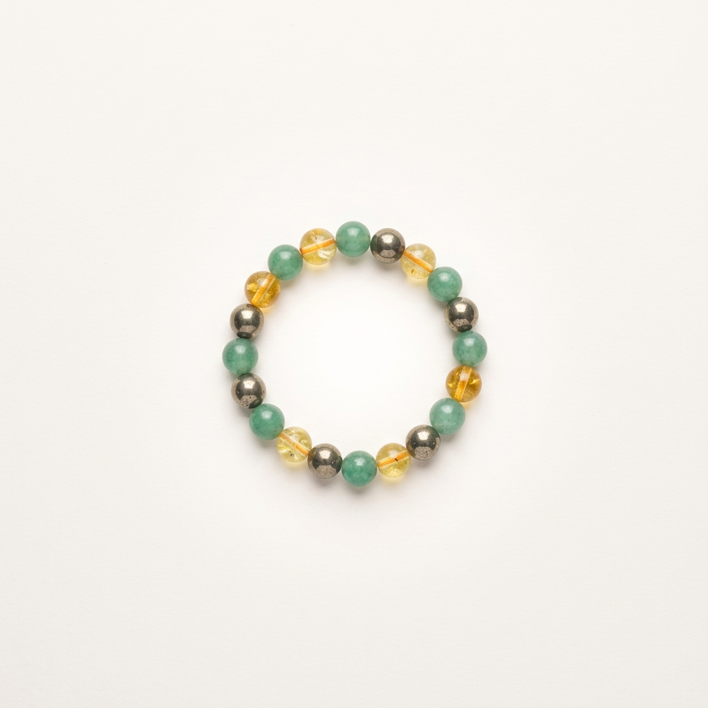 Elegant bracelet featuring aventurine, pyrite, and citrine stones, displayed on a warm, matte almond white background with soft lighting.