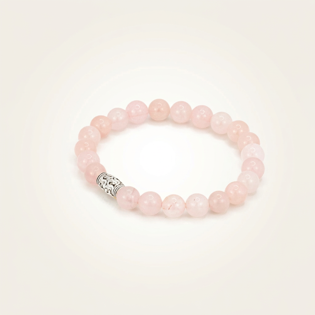 Close-up of a polished rose quartz crystal used for love, healing, and emotional balance, set against a warm, seamless matte background with soft lighting.